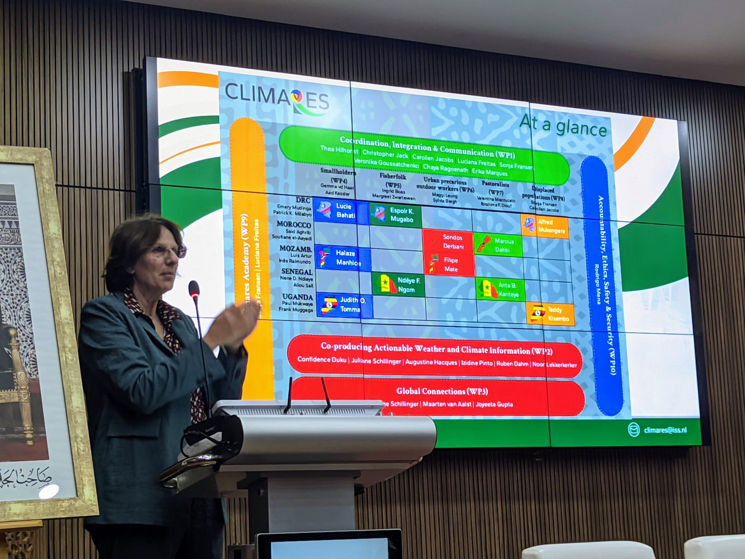 Professor Hilhorst presents the set-up of the consortium. At her back, there is a slide which shows the overview of all the workpackages.